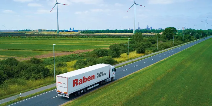 Raben truck goes to deliver cargo in the middle of the field 