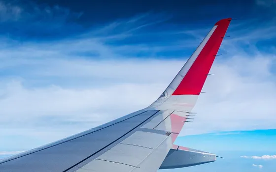 Airplane wing in the sky